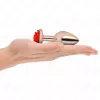 KINK – Rózsaarany színű rozsdamentes acél anál plug piros rózsa díszítéssel, 8,9 cm
