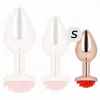 KINK – Rózsaarany színű rozsdamentes acél anál plug piros rózsa díszítéssel, 7,8 cm